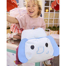 Toddler happily holding a blue elephant-themed backpack with adjustable padded straps, showcasing its playful design.