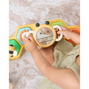 Baby playing with the Skip Hop Tummy Time & Seated Play toy, featuring a bee shape with a mirror and colorful buttons.