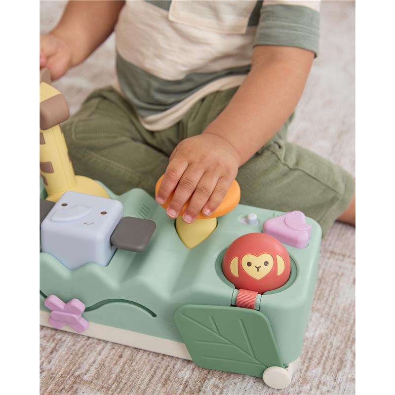 Colorful developmental toy with animal buttons, lights, and music; child interacting with the toy.