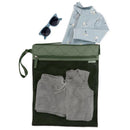 Waterproof wet dry bag in sage color containing a swimsuit, gray shorts, and sunglasses on top.