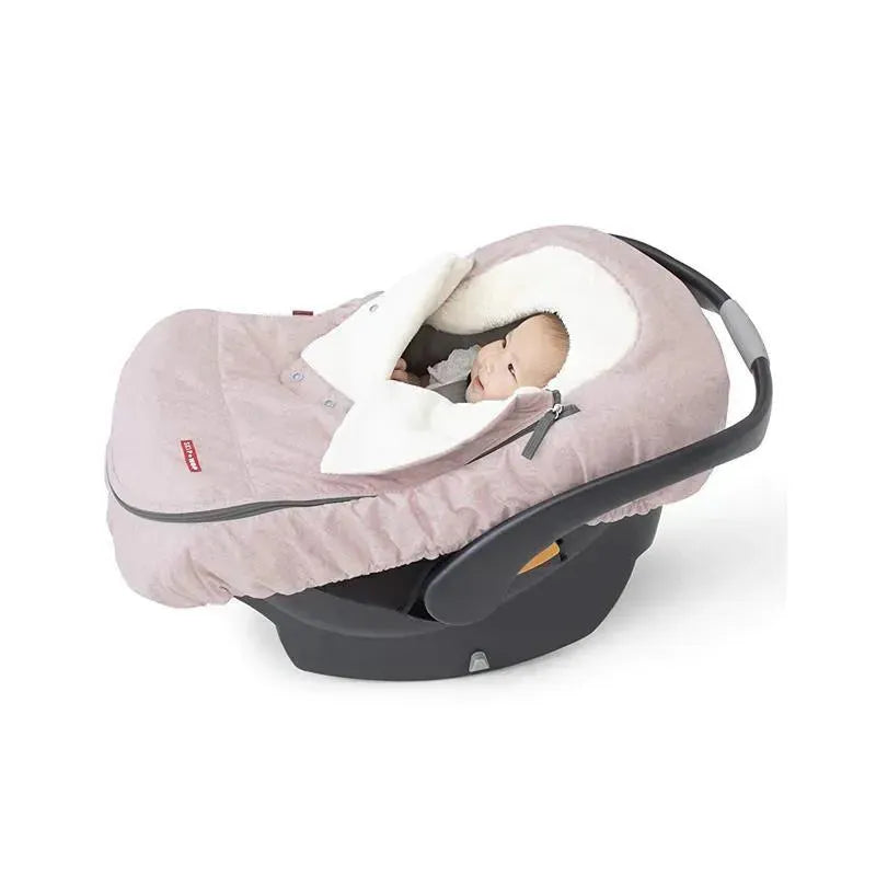 Winter car seat cover in pink heather with a baby peeking out, featuring a soft fleece lining and zippered closure.