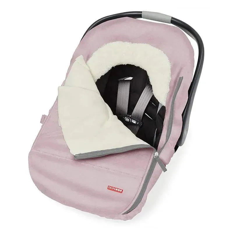 Winter car seat cover in pink heather with cream lining, designed to keep infants warm during cold weather.
