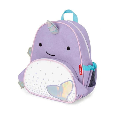 Light purple narwhal-shaped backpack with a smiling face, a shiny tail, and adjustable straps, designed for young children.