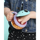 Koala-shaped snack cup with a clear base, designed for children, filled with goldfish crackers, held by a child.