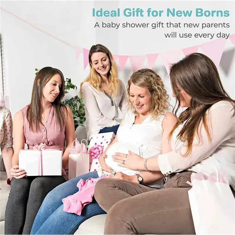 Four women celebrate at a baby shower, smiling and sharing gifts, with a pregnant woman admiring a small pink baby outfit.