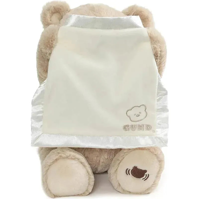 Animated Peek-A-Boo Bear wearing a soft, satin cape, featuring a cute bear logo, ideal for interactive play.