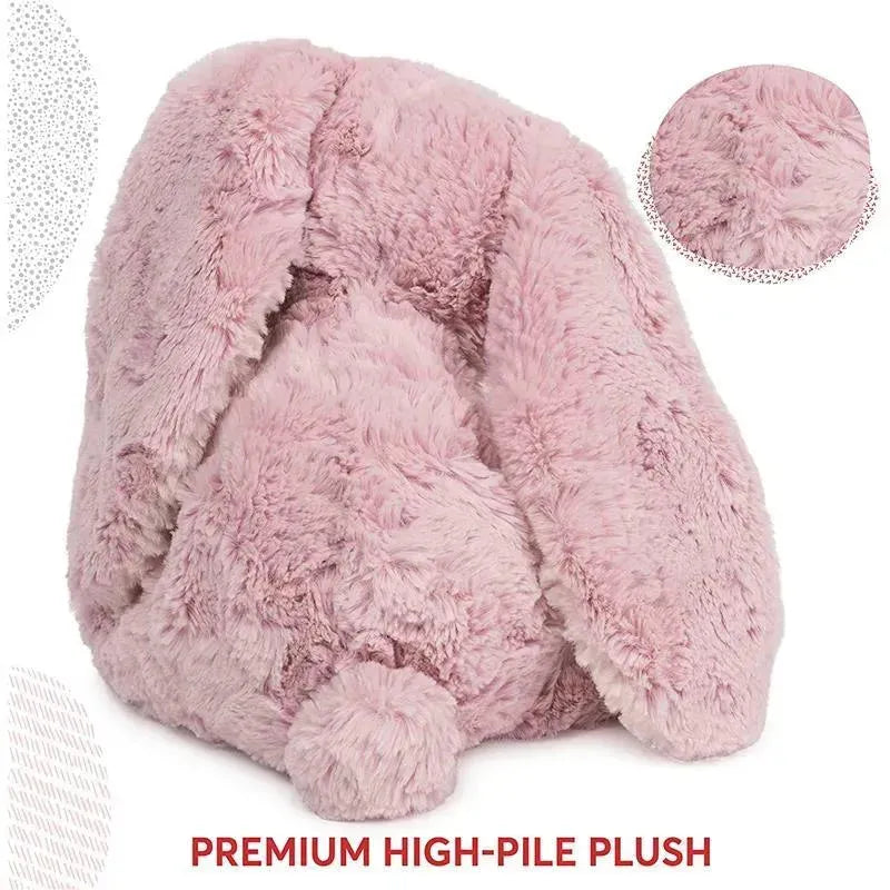 Soft pink bunny plush toy with large floppy ears and a round tail, made from premium high-pile plush fabric.