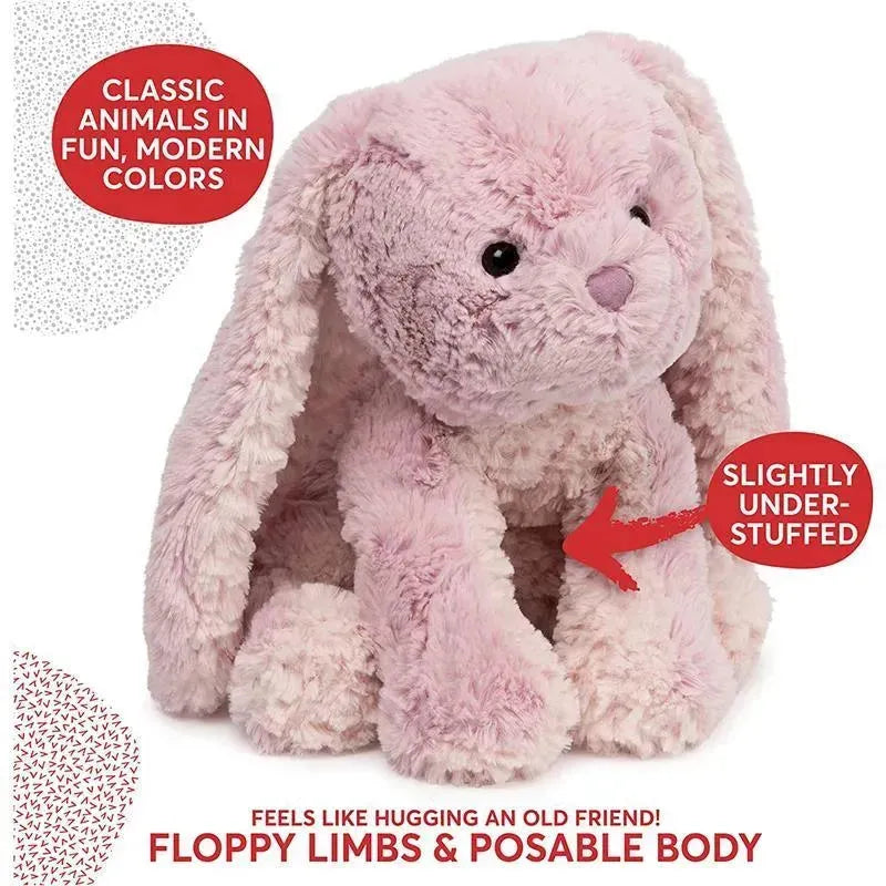 Pink bunny plush from Spin Master’s Cozys Collection featuring floppy limbs, posable body, and a slightly under-stuffed design.