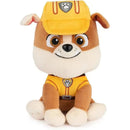 Plush toy of Rubble from PAW Patrol, wearing a yellow construction uniform and cap, suitable for ages 1 and up.
