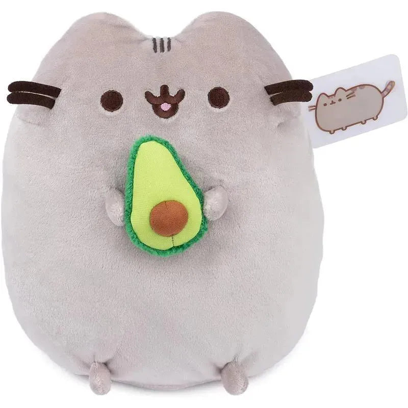 Gray plush Pusheen cat holding a green avocado, designed for ages 8 and up, measuring 9.5 inches.