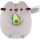 Gray plush Pusheen cat holding a green avocado, designed for ages 8 and up, measuring 9.5 inches.