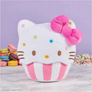 Hello Kitty plush cupcake toy with colorful sprinkles, pink bow, and macarons in the background.