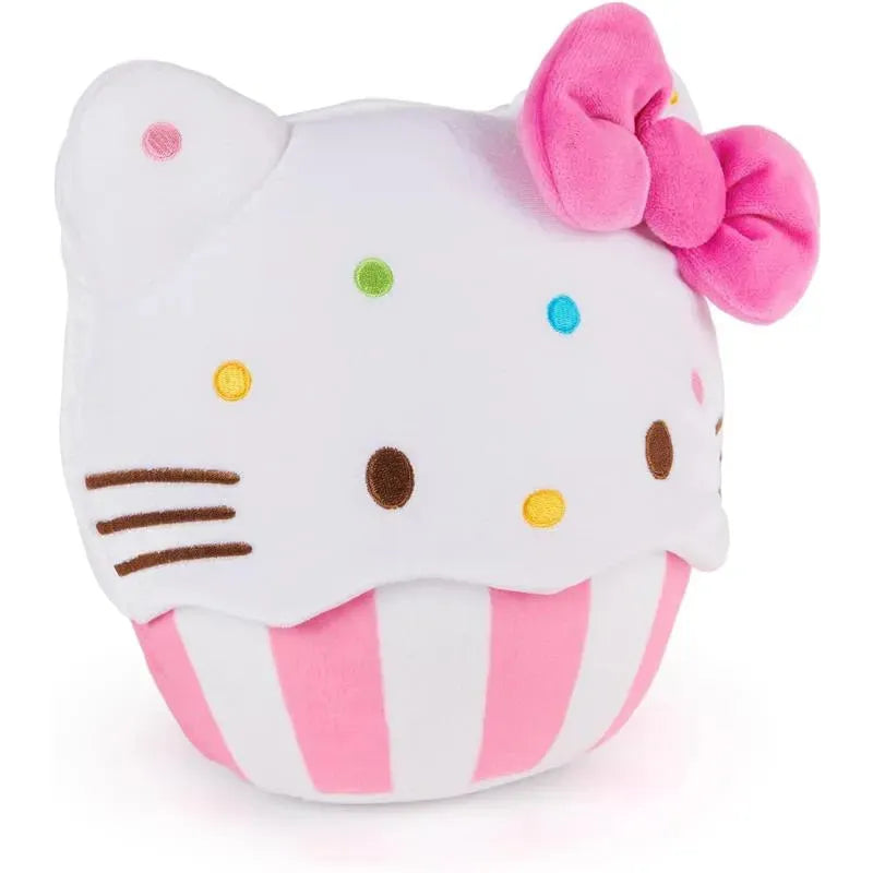 Hello Kitty plush toy shaped like a cupcake, featuring colorful sprinkles and a pink bow on top.
