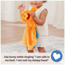 A smiling toddler holds a bright orange security blanket with a character face, on a soft rug with a message about bedtime singing.
