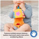 Baby happily playing with the Spin Master Ms. Rachel Herbie Sensory Take A Long Toy, featuring a teether ring, peek-a-boo action, and bright colors.