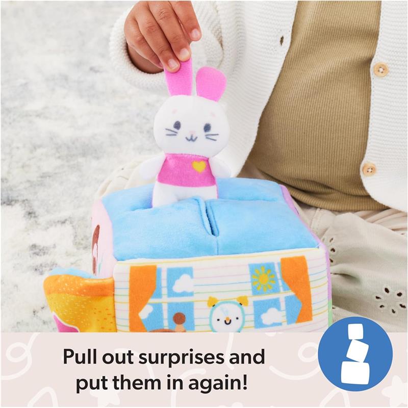 Spin Master Ms. Rachel Official Surprise Learning Box featuring a child pulling out a plush bunny toy from a colorful soft block, with instructional text.