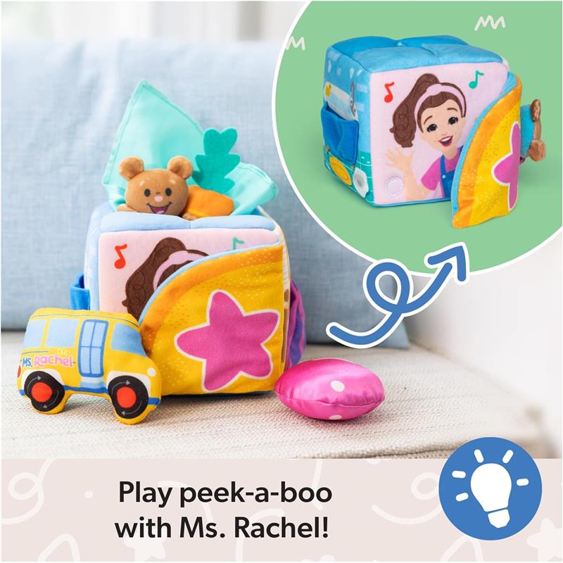 Spin Master Ms. Rachel Surprise Learning Box features a colorful, plush cube with peek-a-boo elements and soft toys, including a bear and a vehicle.