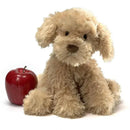 10.5-inch plush cockapoo puppy in a sitting position next to a red apple.