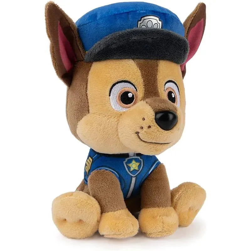 Plush toy of Chase from PAW Patrol, dressed in a blue police uniform with a cap, sitting upright with a friendly expression.