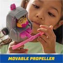 Paw Patrol toy car featuring a movable pink propeller and Skye action figure, held by a child.