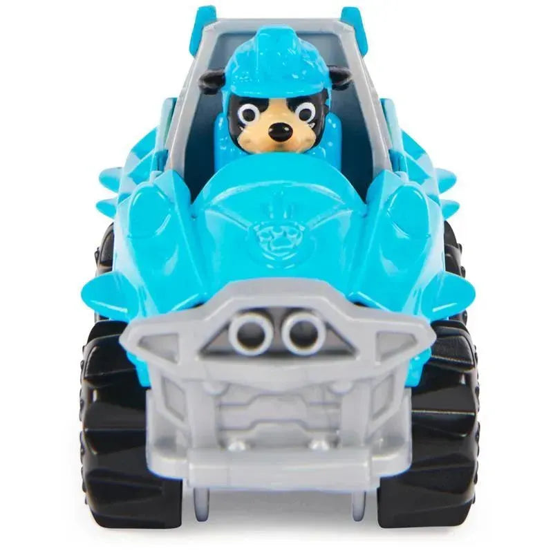Spin Master Paw Patrol True Metal Dino Rescue Rex, featuring a blue vehicle with spikes and a dog character in a helmet.