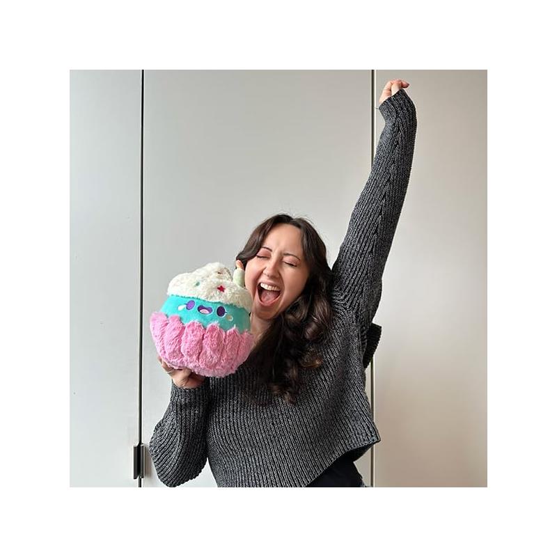 Mini Comfort Food Party Cupcake plush held by a woman with long hair, smiling and celebrating.
