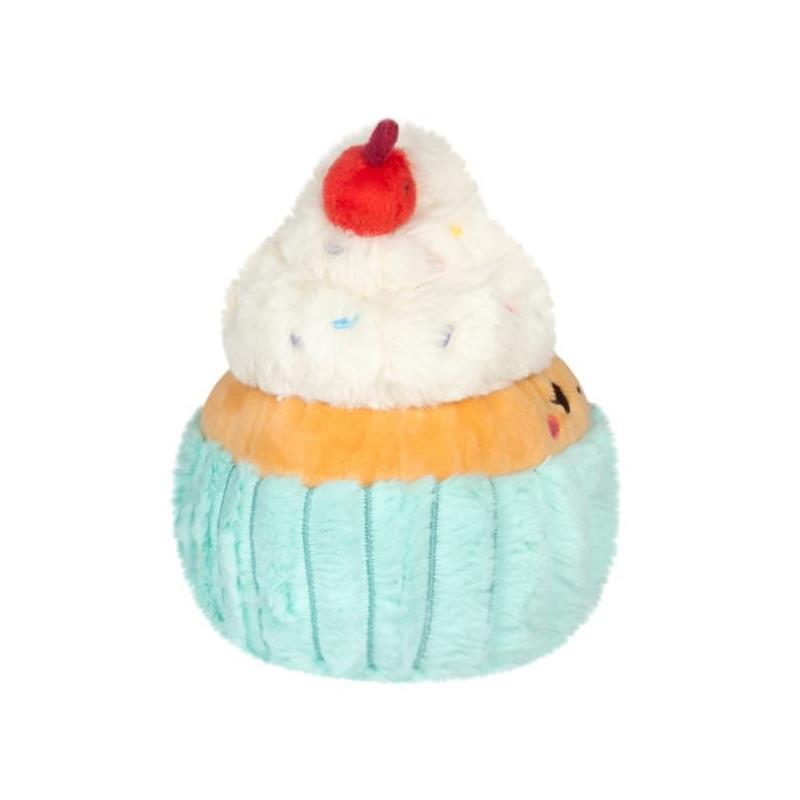 Plush cupcake toy with a teal base, orange cake layer, white frosting, and a cherry on top.