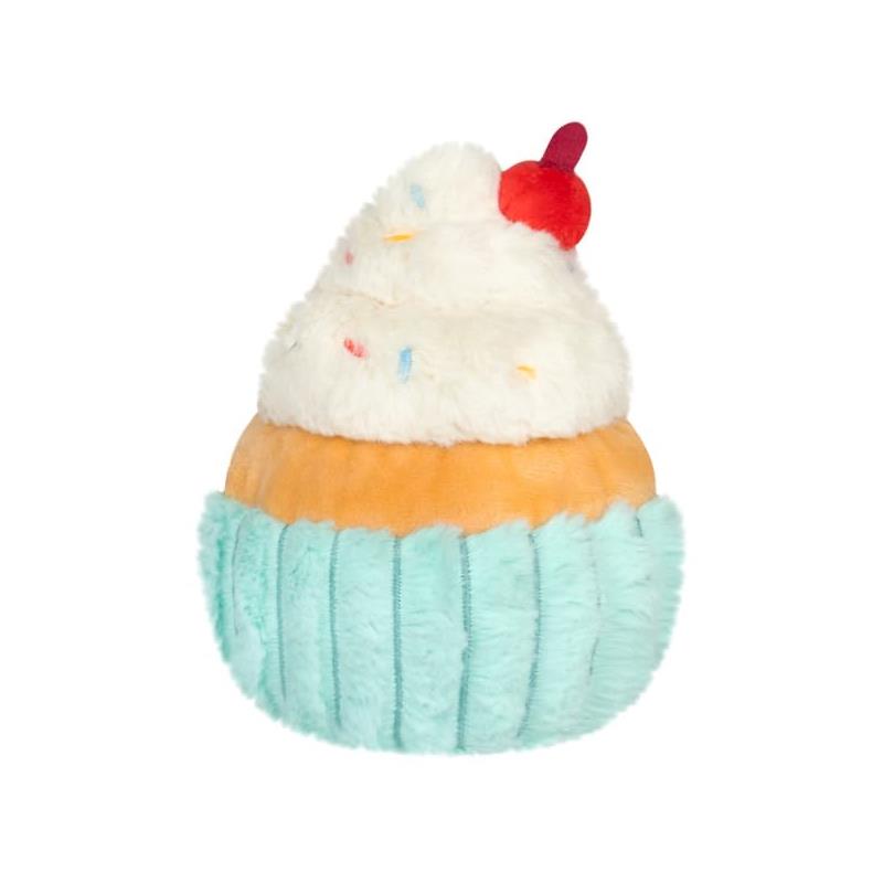 Soft plush cupcake toy with a turquoise wrapper, orange base, fluffy white frosting, and a red cherry on top.