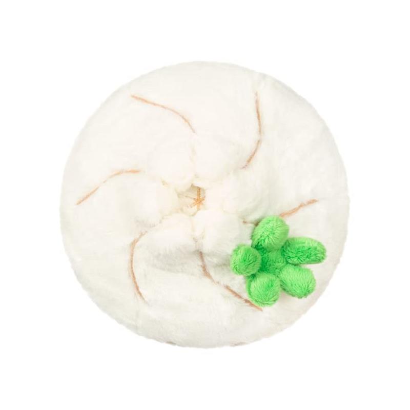 Soft, round plush dumpling with a white exterior, brown detailing, and a green fabric garnish.