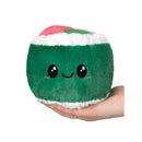 Plush green sushi roll with a smiling face, held in a hand, featuring pink and green toppings.