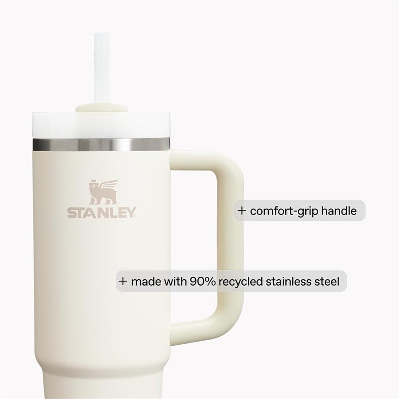 Stanley The Quencher H2.0 FlowState™ Tumbler 40 oz in cream color with a comfort-grip handle and eco-friendly design details.
