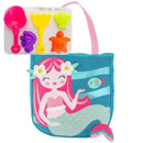 Mermaid-themed beach tote featuring a smiling mermaid design, accompanied by colorful sand toys: shovel and molds.