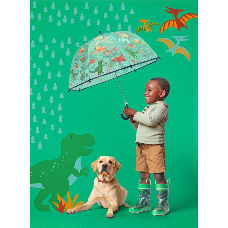 A child joyfully holds a clear, color-changing bubble umbrella featuring sharks, next to a golden retriever, on a playful green background.