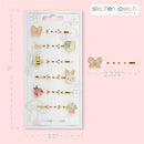 Set of seven Stephen Joseph enamel hair pins featuring a bunny, bee, butterfly, snail, ladybug, and mushroom on a card.
