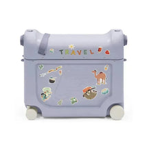 Stokke Jetkids™ Bedbox™ in Arctic Blue, featuring colorful travel-themed stickers and wheels for easy mobility.