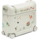 Stokke Jetkids™ Bedbox™ in sea green with travel-themed stickers and wheels for easy mobility.