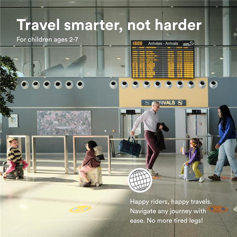 Stokke Jetkids™ Bedbox™ in Sea Green, showcased with children using it at an airport, highlighting travel convenience.