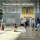 Stokke Jetkids™ Bedbox™ in Sea Green, showcased with children using it at an airport, highlighting travel convenience.