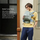 Stokke Limas™ Mesh carrier in Glacier Green, featuring a man holding an infant securely against his chest.