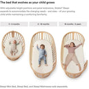 Stokke Sleepi Canopy in white, featuring three cribs designed for different age groups with children lying inside.