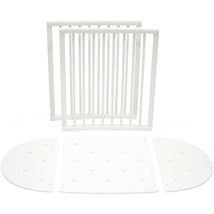 Stokke Sleepi™ Bed Extension in white, featuring two slatted side panels and two rounded end panels for bed size extension.