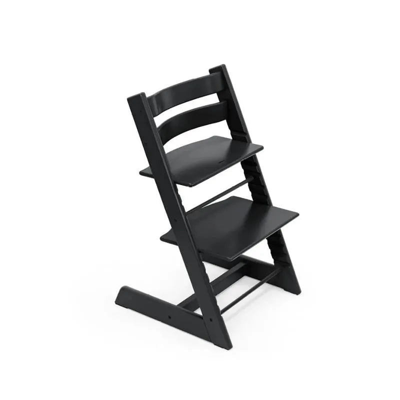 Stokke Tripp Trapp high chair in Glacier Green with a cushion and tray, designed for child seating and feeding.