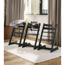 Stokke Tripp Trapp high chair set in Glacier Green, featuring a cushion and tray, arranged in a modern interior setting.