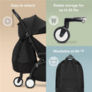 Black Stokke Yoyo Bag attached to a stroller, highlighting its features: easy attachment, stable storage for 22 lbs, and washable at 86°F.