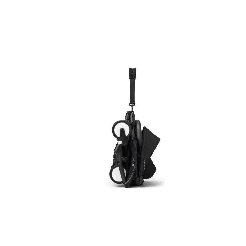 Stokke Yoyo³ stroller folded with a black frame and bundle leg rest, featuring a sleek, compact design.