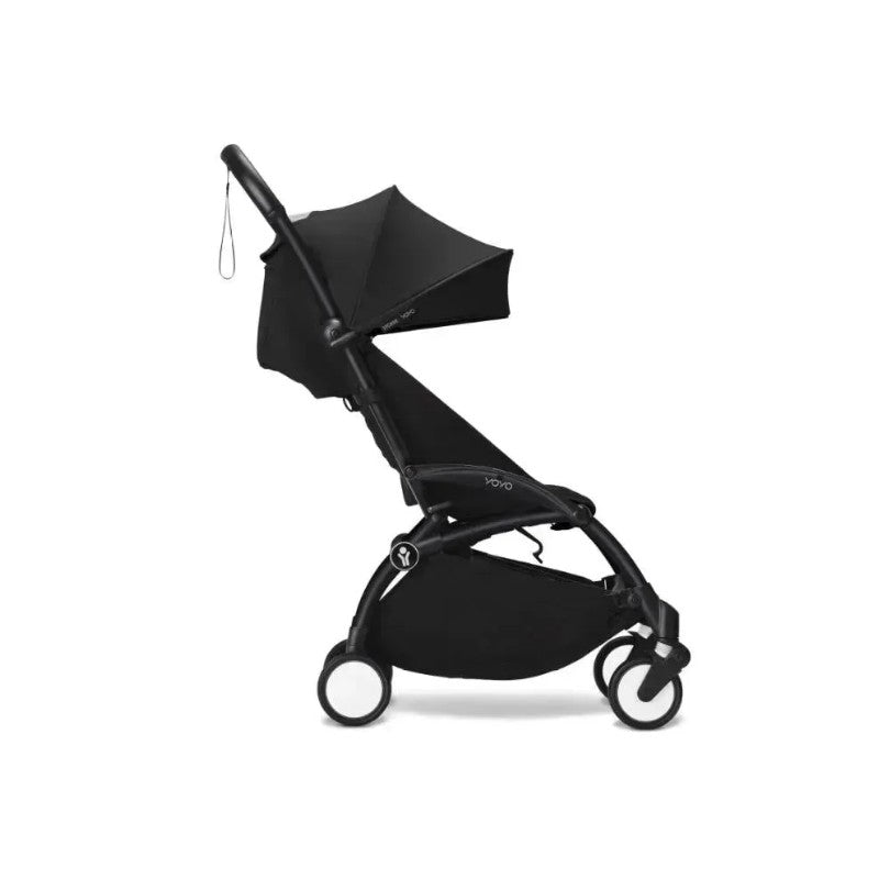 Stokke Yoyo³ stroller 6+, featuring a black frame and fabric, with a raised sunshade and compact design.
