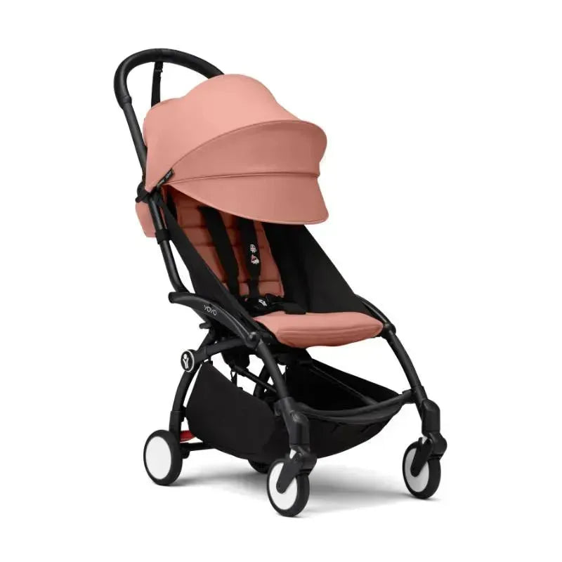 Stokke Yoyo³ stroller in black and ginger, featuring a large canopy and a compact design for easy maneuverability.