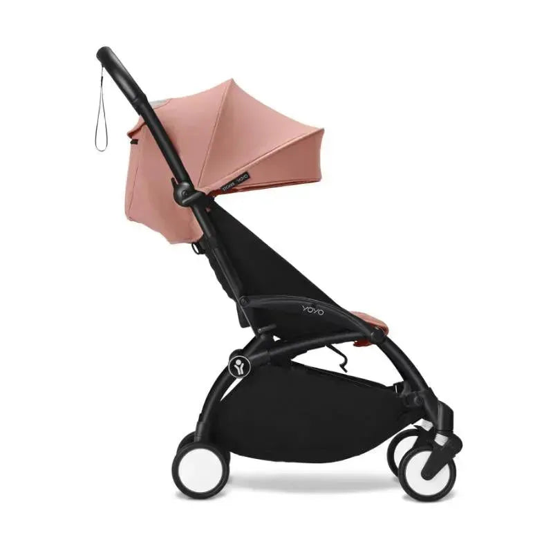 Stokke Yoyo³ stroller in black and ginger, featuring a lightweight design and adjustable canopy, suitable for children 6+.