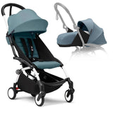 Stokke Yoyo° stroller bundle in black and white frame with aqua color pack and newborn pack, featuring a reclining seat and bassinet.