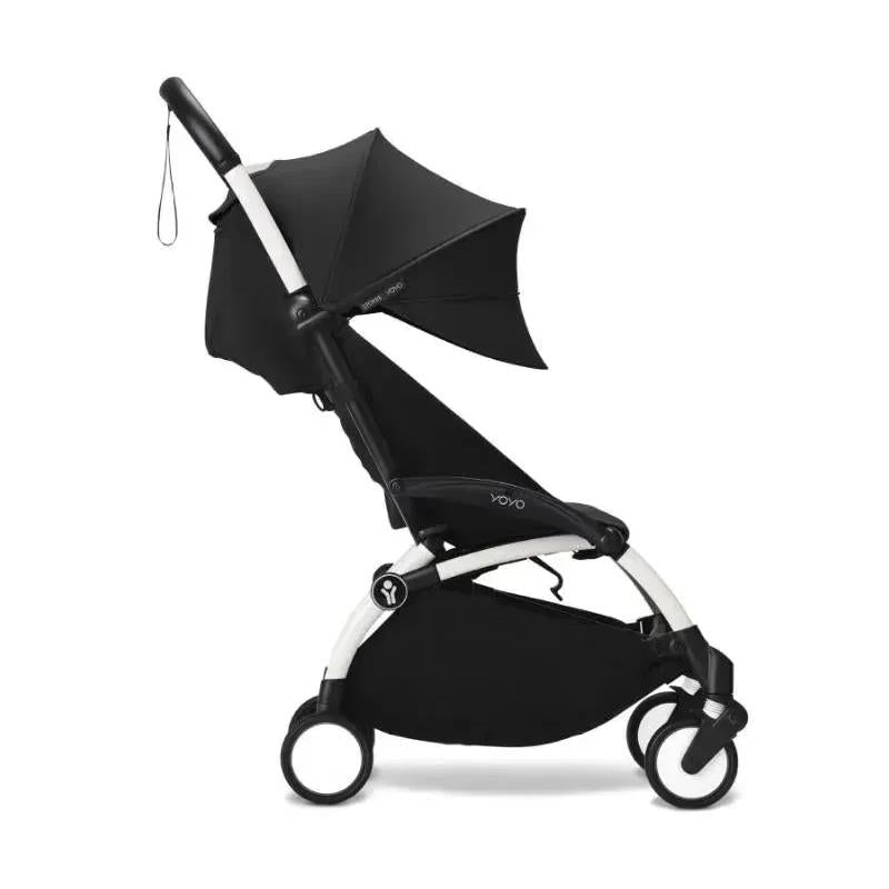 Stokke Yoyo³ stroller bundle in black and white, featuring a black canopy and compact design for newborns.